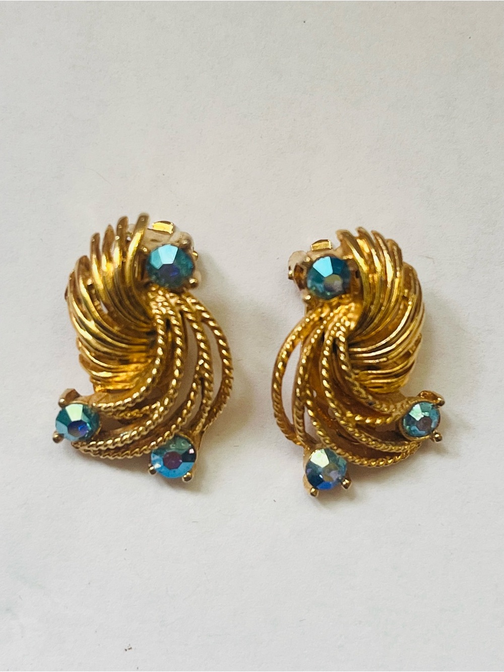 Gold Swirl Clip Earrings with Blue Aurora Rhinestones